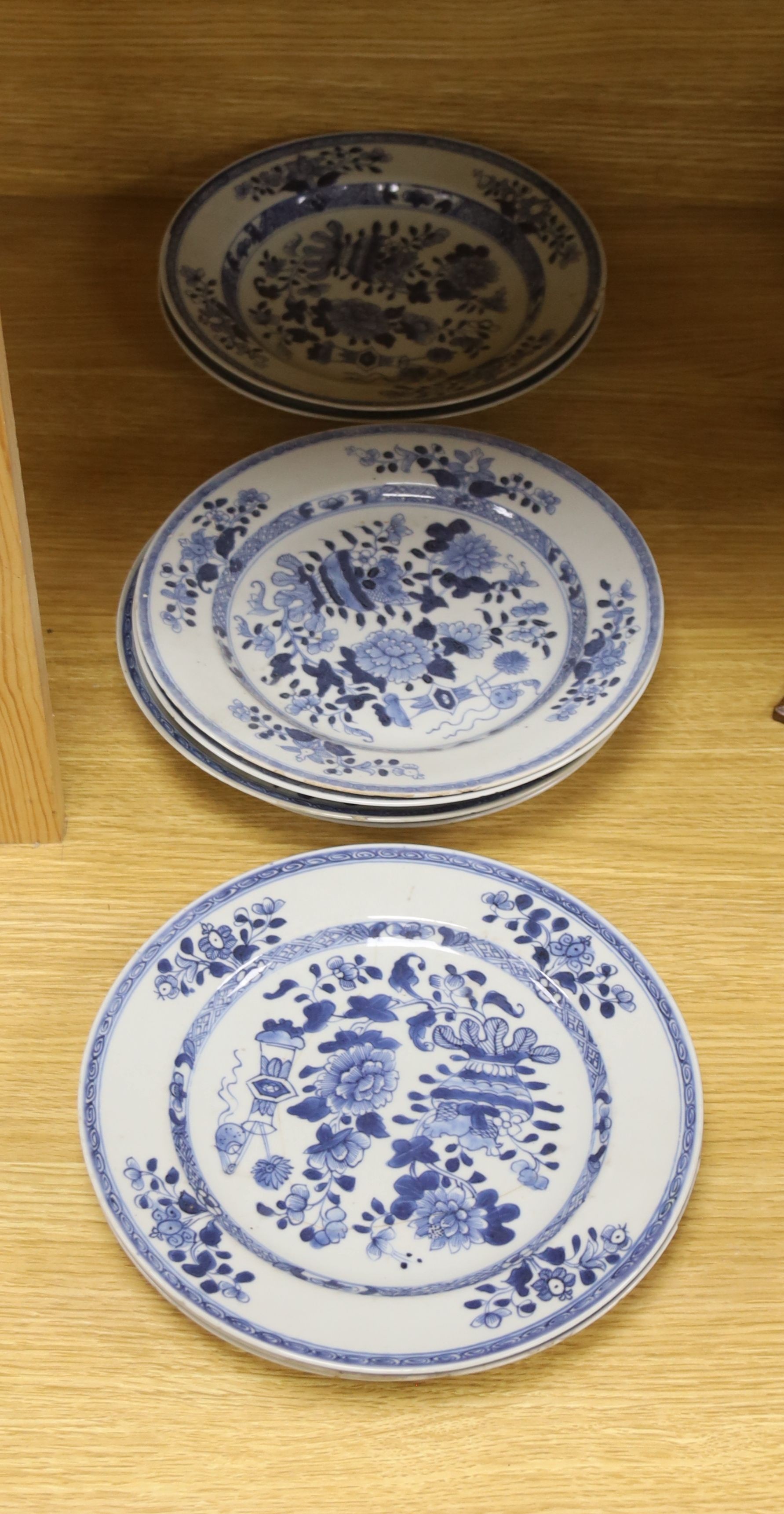Six 18th century Chinese Export blue and white dishes with floral decoration and five matching plates, Dia 23cm